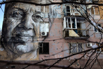 Avdiivka : A portrait of an elderly woman named Marina  Marchenko who was a teacher,  painted by an Australian artist  is seen on a war torn building, abandoned  in Avdiivka.After more than six years of war the armed conflict in eastern Ukraine has a human toll that is staggering. Some 200,000 people live under constant fear of shelling every day, with nearly a third of the 3.4 million people in need of humanitarian assistance over 60 years of age. Ukraine has the highest proportion of elderly affected by war in the world.BANGKOK - MARCH  :  in Taipei, Taiwan on March 19, 2020. According to CDC current totals the Coronavirus ( COVID-19) has now effected 235,939 globally, killing 9,874. It has spread to 157 countries. (Photo by Paula Bronstein/Getty Images )