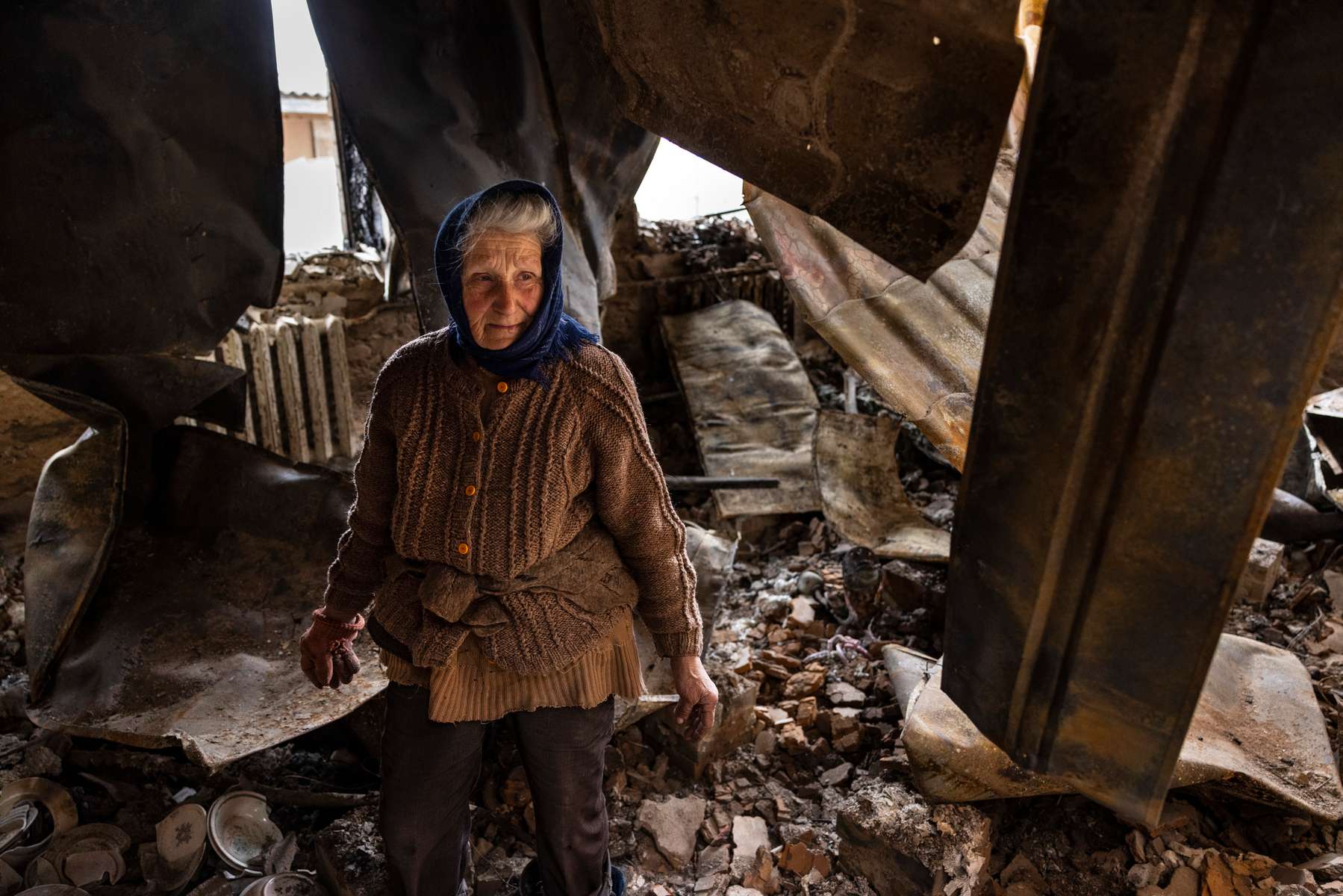 CHERNIHIV: Galina Selivon, 77, stands in her destroyed home on April 16, 2022 her home for 50 years. She lives by herself, her husband and also her son died, only her grandson is alive in Kyiv. She survived the bombing in the basement used for potato storage. 