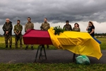 As rain clouds approach at a Kharkiv cemetery, soldiers and relatives attend a military funeral for Denys Anatskyi, 26, a senior soldier killed near Chuhuiv on June 20th.