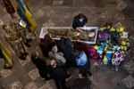 The body of  Bogdan Volodymyrovych Holyb, 52,  killed near Dryzba in Luhansk region on May 15th is surrounded by family at a cathedral in Lviv. 