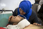 KABUL, AFGHANISTAN -MARCH 21, 2016: Azim, 25, a a quadriplegic who suffered bullet wounds to his face and shoulder gets visited by his wife Shokoria for the first time at the Emergency hospital in Kabul on March 21, 2016. Every year the UN comes out with their report documenting the unfortunate carnage from America’s longest and most costly war in history. Along with the price tag estimated in the hundreds of billions, the human toll from a 2015 UN Assistance Mission To Afghanistan (UNAMA) report stated the number of Afghan civilians killed and wounded surpassed 11,000.  which was the deadliest on record for civilians in Afghanistan since the US-led invasion more than 14 years ago. 
