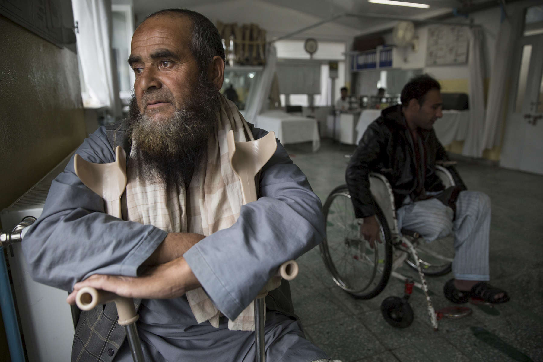 KABUL, AFGHANISTAN -APRIL 2, 2016: Abdul Ahad, a double amputee from a mine explosion in Ghazni rests after a day of walking on his new prosthetics. At the ICRC Orthopedic center disabled ANA military patients get their new prosthetic aligned by a  orthopedic therapist. Every year the UN comes out with their report documenting the unfortunate carnage from America’s longest and most costly war in history. Along with the price tag estimated in the hundreds of billions, the human toll from a 2015 UN Assistance Mission To Afghanistan (UNAMA) report stated the number of Afghan civilians killed and wounded surpassed 11,000.  which was the deadliest on record for civilians in Afghanistan since the US-led invasion more than 14 years ago. 