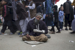 KABUL, AFGHANISTAN -MARCH 20, 2016: Ibrahim, a mine victim begs on the street during the Afghan New Year festival hoping that many would have sympathy in Kabul on March 20, 2016. Many handicapped who are unemployed become beggars. Afghan civilians are at greater risk today than at any time since Taliban rule. According to UN statistics, in the first half of 2016 at least 1,600 people had died, and more than 3,500 people were injured, a 4 per cent increase in overall civilian causalities compared to the same period last year. The upsurge in violence has had devastating consequences for civilians, with suicide bombings and targeted attacks by the Taliban and other insurgents causing 70 percent of all civilian casualties.  