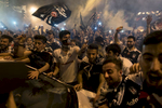 Supporters block traffic in Besiktas district as they celebrate the Turkish Super League title after the last match of the season against Osmanlispor in Istanbul, Turkey, Saturday, June 3, 2017.