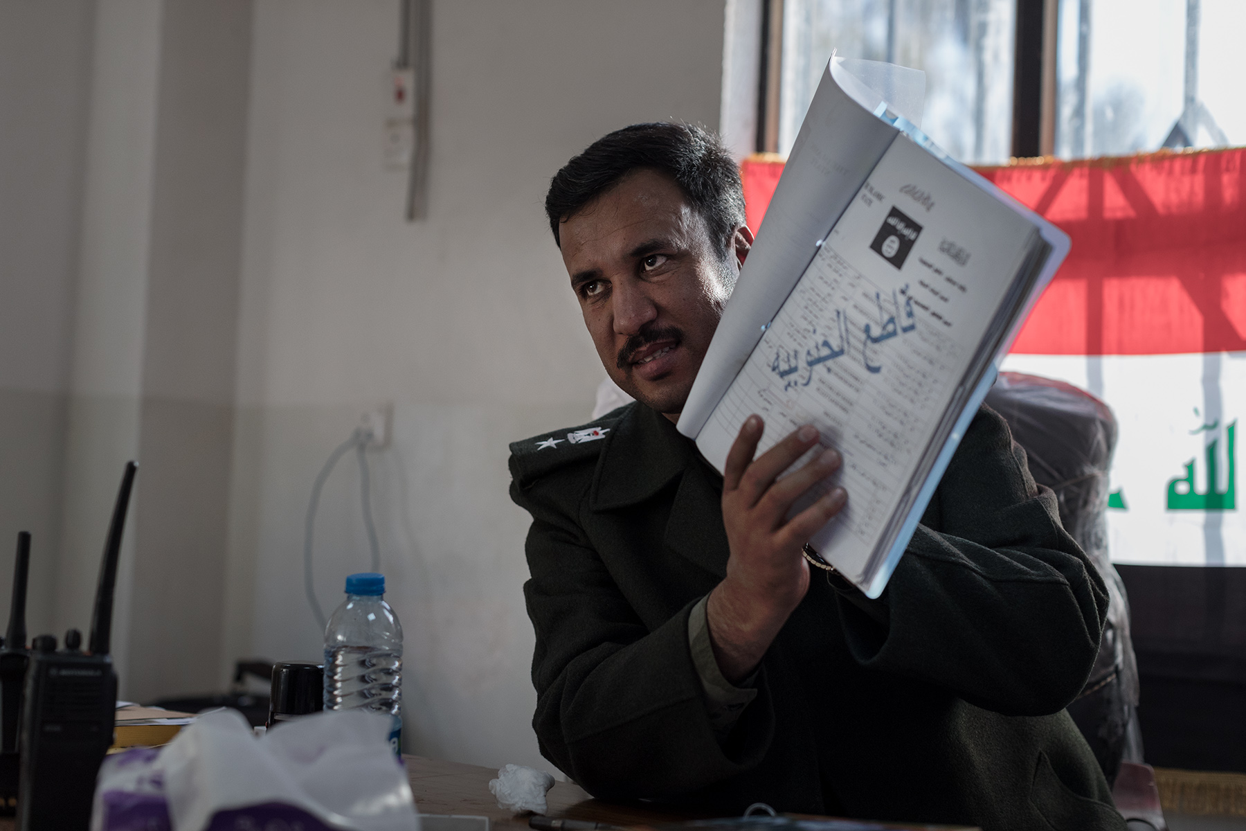 Lieutenant Colonel Yassin Ahmad Abbas, chief of Hammam al-Alil police, seriously injured during an ISIS attack, shows in his office a list with several ISIS members. Hammam al-Alil, Iraq on Jan. 9, 2017. According to him, time of vengeance will come. 