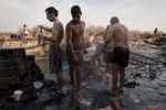 Sulphured waters smoke in concrete vats on the edges of the Tiger, in the thermal city of Hammam al-Alil, Iraq on Jan. 8, 2017. Men and boys gather there to wash and to relax themselves. 