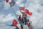 Supporters of the main opposition Republican People's Party (CHP) presidential runner Muharrem İnce wave flags during a small rally in Istanbul western suburbs on June 10, 2018