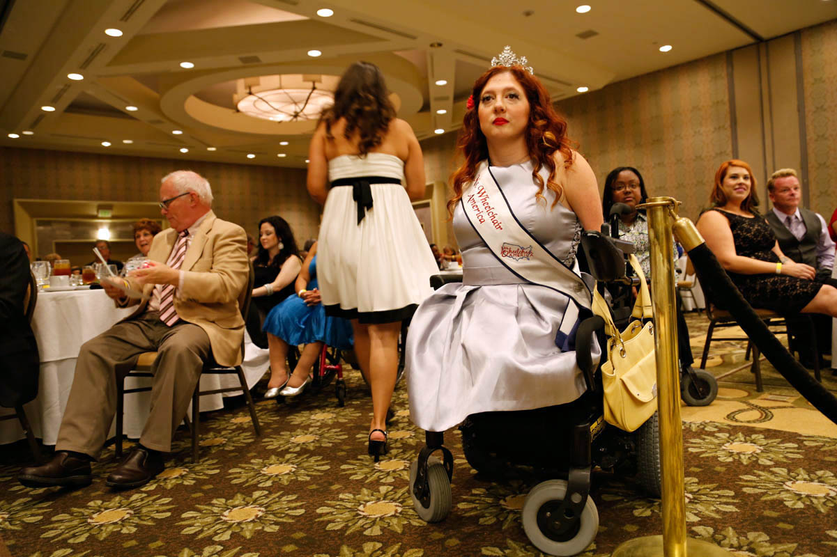 Jennifer Adams, from Tacoma, WA, the reigning Ms. Wheelchair America 2014, watches the judging. Adams, who has a BA in psychology and a Master’s in counseling, is a motivational speaker. She sees her disability as a gift, which “actually forges something inside of you, a strength maybe other people don’t have.” 