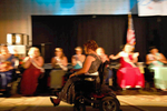 Kelsey Kleimola, Ms. Wheelchair Michigan 2014, whizzes past the line of contestants in her motorized wheelchair. Long Beach, CA. August 9, 2014.
