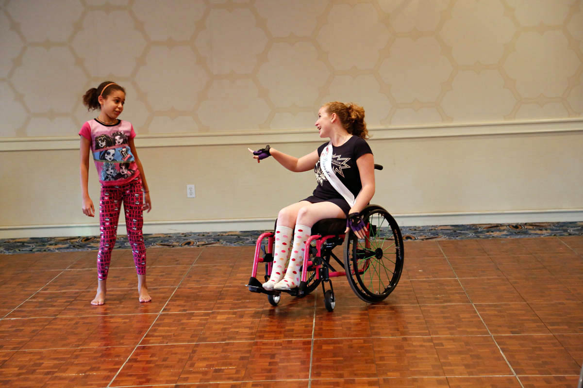 Stephanie Woodward, Ms. Wheelchair Florida 2014, dances with the child of another contestant during a pajama party held during the week of the pageant. Woodward is an attorney and disability rights advocate, who’s been arrested twice, while protesting disability discrimination. 