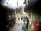 Burka-clad women walk down a Kabul street. Virtually all women in Kabul cover themselves in public -- most with a burka, others with long headscarves.