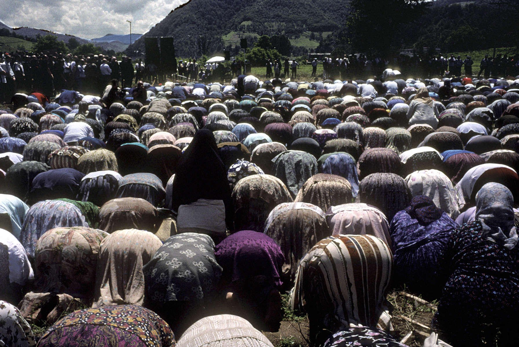 Muslim widows pray during ceremonies marking the groundbreaking of a memorial site for the 7,000 to 8,000 Muslim men and boys who were slaughtered when Srebrenica was overrun by Serb forces in July 1995. The memorial is a few kilometers down the road from Srebrenica, across from a now-abandoned factory, where many of the men were kiled.