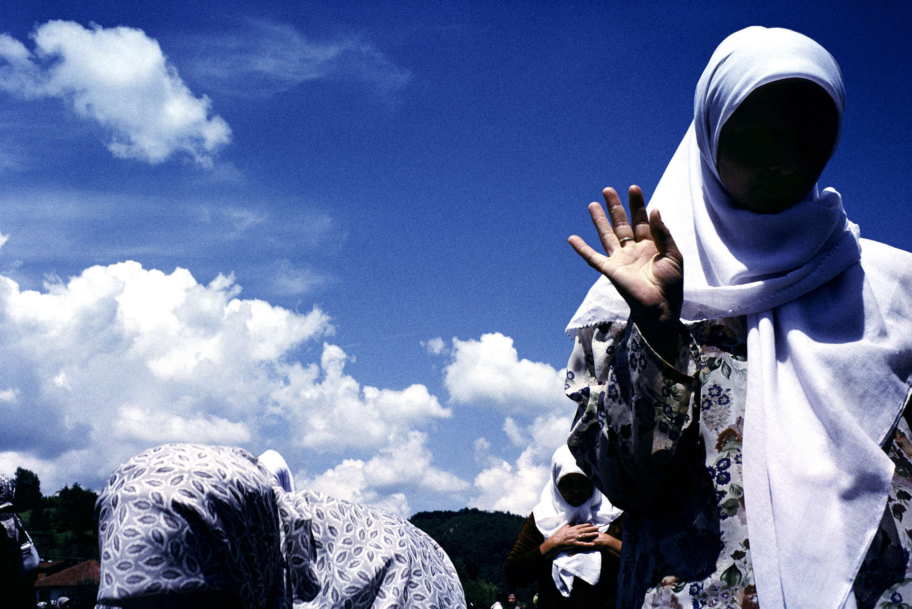 Muslim widows during the prayer for the dead offered at the groundbreaking of a memorial site for the 7,000 to 8,000 Muslim men and boys who were massacred by Bosnian Serb forces in 1995.