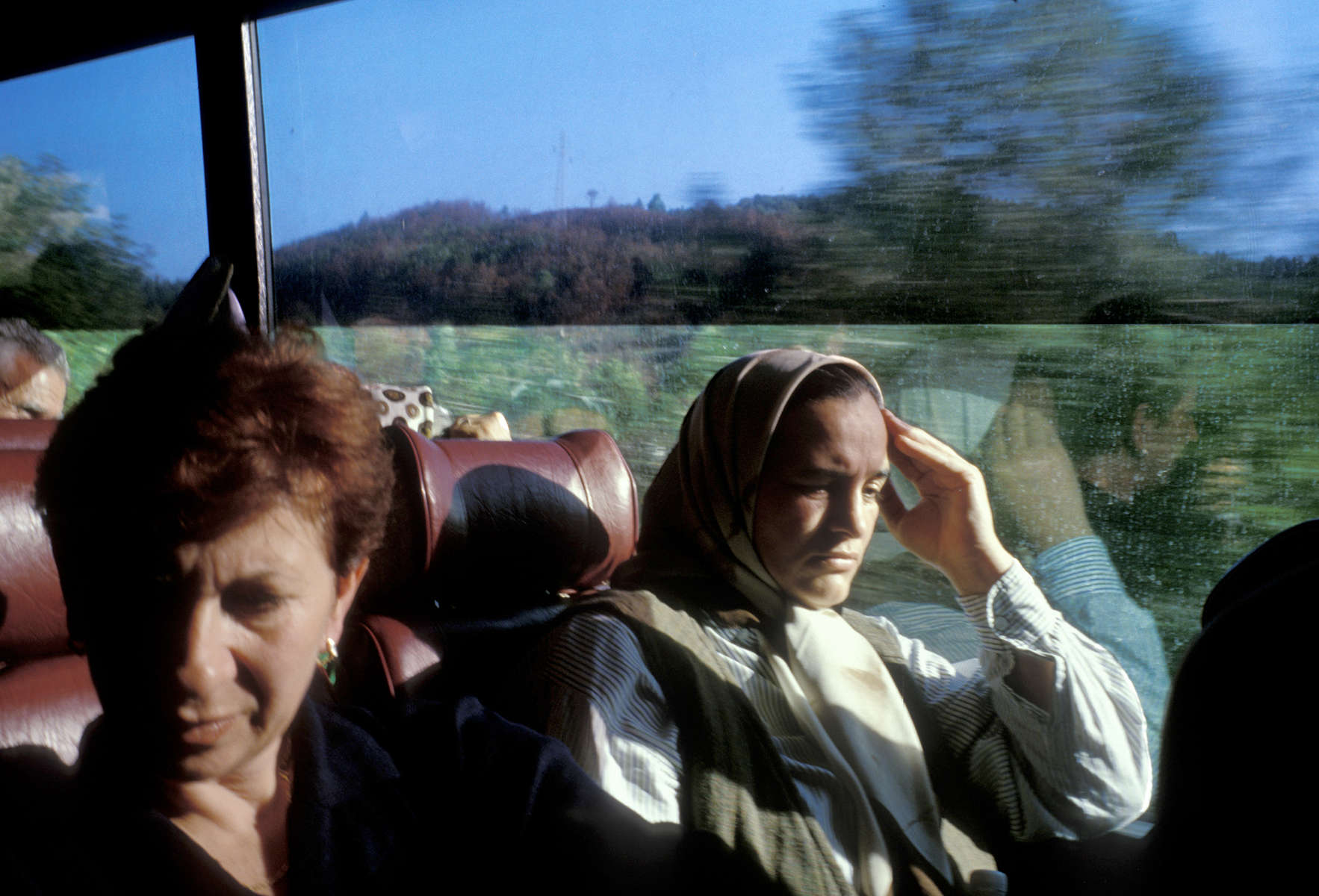 Srebrenica widows head back to Sarajevo after a day spent in Srebrenica, where they had gone to see the homes they were forced to leave in 1995, when Serb forces overran their town and massacred 7,000 to 8,000 men and boys. Most of the widows\' homes were occupied by Serb refugees after the end of the war, and the women were beginning the legal process of reclaiming their property -- and deciding whether they wanted to return to their homes. October 2000.