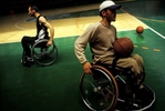 Members of the 3K Sarajevo wheelchair basketball team during a break from practice. Most of the players were wounded as civilians or as soldiers on the frontline during the 1992-95 war. The young man in the foreground was shot by a sniper when his parents let him go outside to celebrate his thirteenth birthday. Bosnia now has eight wheelchair basketball teams, made up almost entirely of young men wounded during the war.