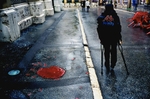 At left is a \{quote}rose\{quote} of Sarajevo, which marks one of the mortar blasts fired at the city by Serb forces. Mortar blasts leave a pattern that looks like a flower; after the war, blasts that killed large numbers of people were filled in with red as a commemoration to those who died. September, 2002.