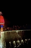 A model walks down the runway during a fashion show staged at midnight on the eve of the tenth anniversary of the beginning of the siege of Sarajevo. Although there were few events sponsored by the city to mark the occasion, artists and young people -- many of whom lived through the siege as children -- put on the fashion show, which featured clothes worn by famous people during the war, including the beret of former president Alija Izetbegovic, filmmaker Danis Tanovic\'s sleeping bag,a nd the track suits worn by two Olympic athletes who snuck out of Sarajevo during the siege and marched in the opening ceremony of the Barcelona Olympics, to remind the world of the tragedy that was unfolding in Bosnia.