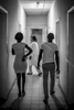 After discussing various family planning methods with a counselor, this young couple decide to get a contracpetive implant that will last for 5 years. They are in their early twenties and already have four children. They follow the doctor to a room to get the procedure done, at a clinic in Kinshasa. September 2016.