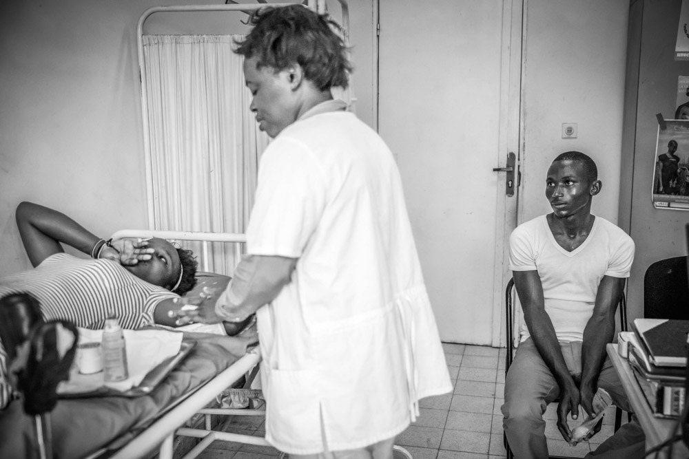 Miriam and Flory are in their early twenties and have four children. Nurse Bamato-Mboyo administers a contraceptive implant that lasts for five years. September, 2016. 