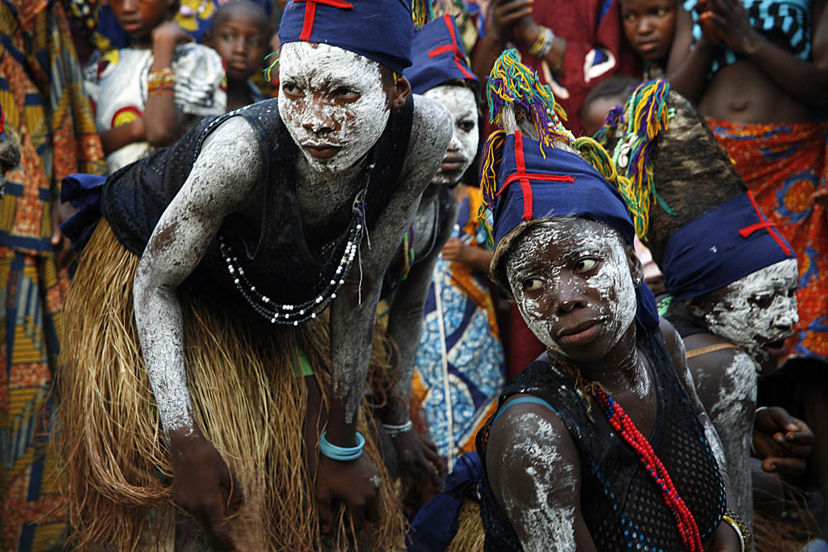 Young girl dancers, in traditional Kono dress, perform at a welcome ceremony before a Fambul Tok bonfire that evening.