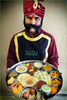 India-Doorman-with-classic-Indian-cuisine-Carl-Kravats-Photography