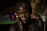 A widow mourns her husband who was killed by an unknown armed group the previous night.  A series of deadly attacks on the villages surrounding Juba and the roads to Kenya and Uganda led to the displacement of civilians and rapid price increases in the regional capital.Gumbo, Central Equatoria State