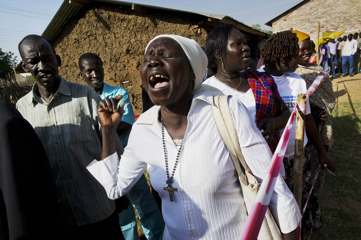 A woman ululates as she waits in line to cast her ballot in the long-awaited self-determination referendum.Juba, southern Sudan