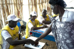 A voter places her thumbprint on the voting rolls before casting her ballot in the referendum.Malakal, southern Sudan