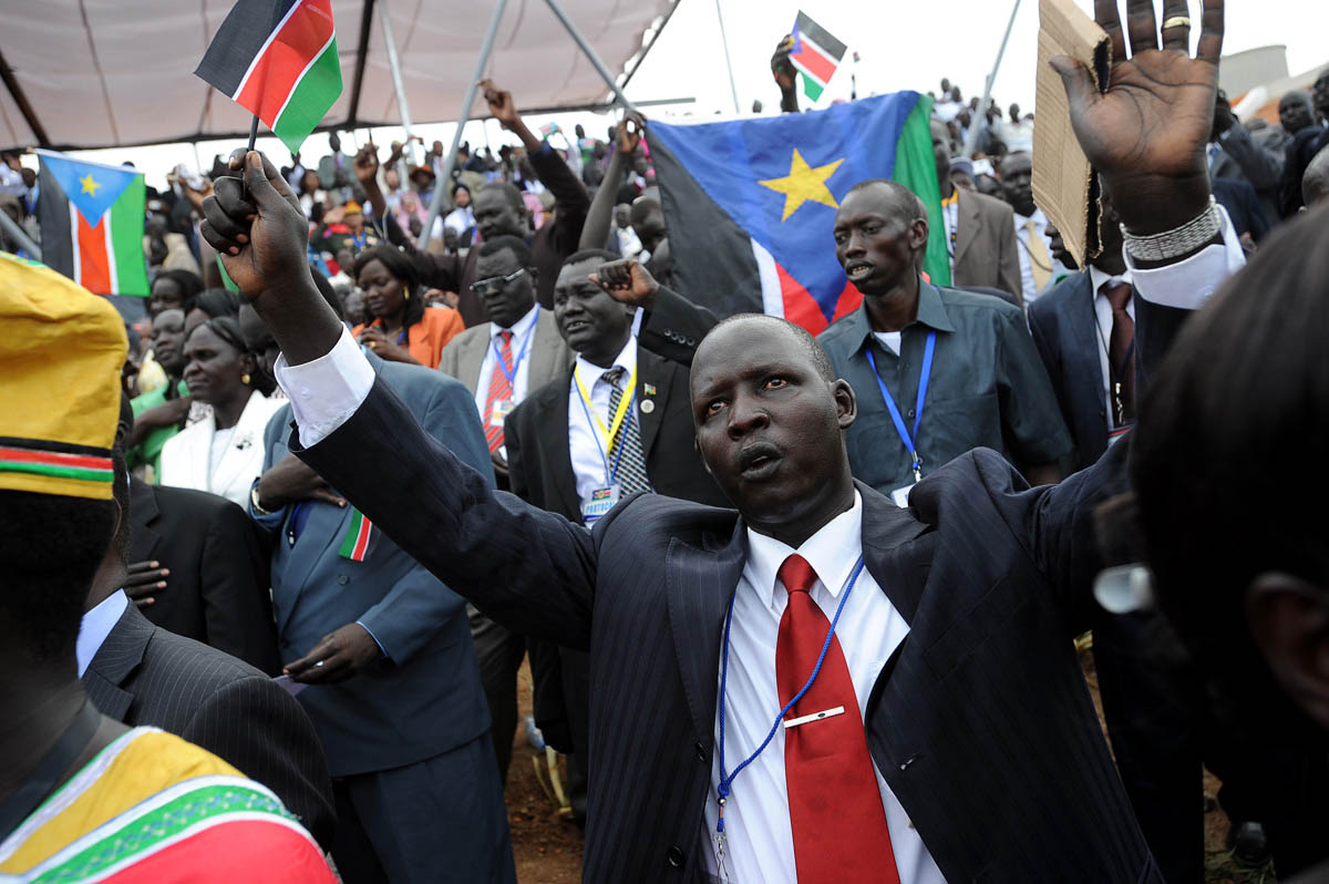 Citizens sing the new South Sudanese national anthem after the official proclamation of independence.Juba, South Sudan