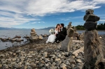 A couple enjoying a quiet time on the rocky beach in Lake Tahoe 