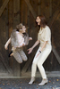 mother and daughter jumping at Tall Timber Barn, family portraits