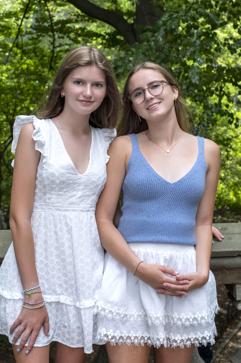 Sisters posing for fall portraits in Central Park