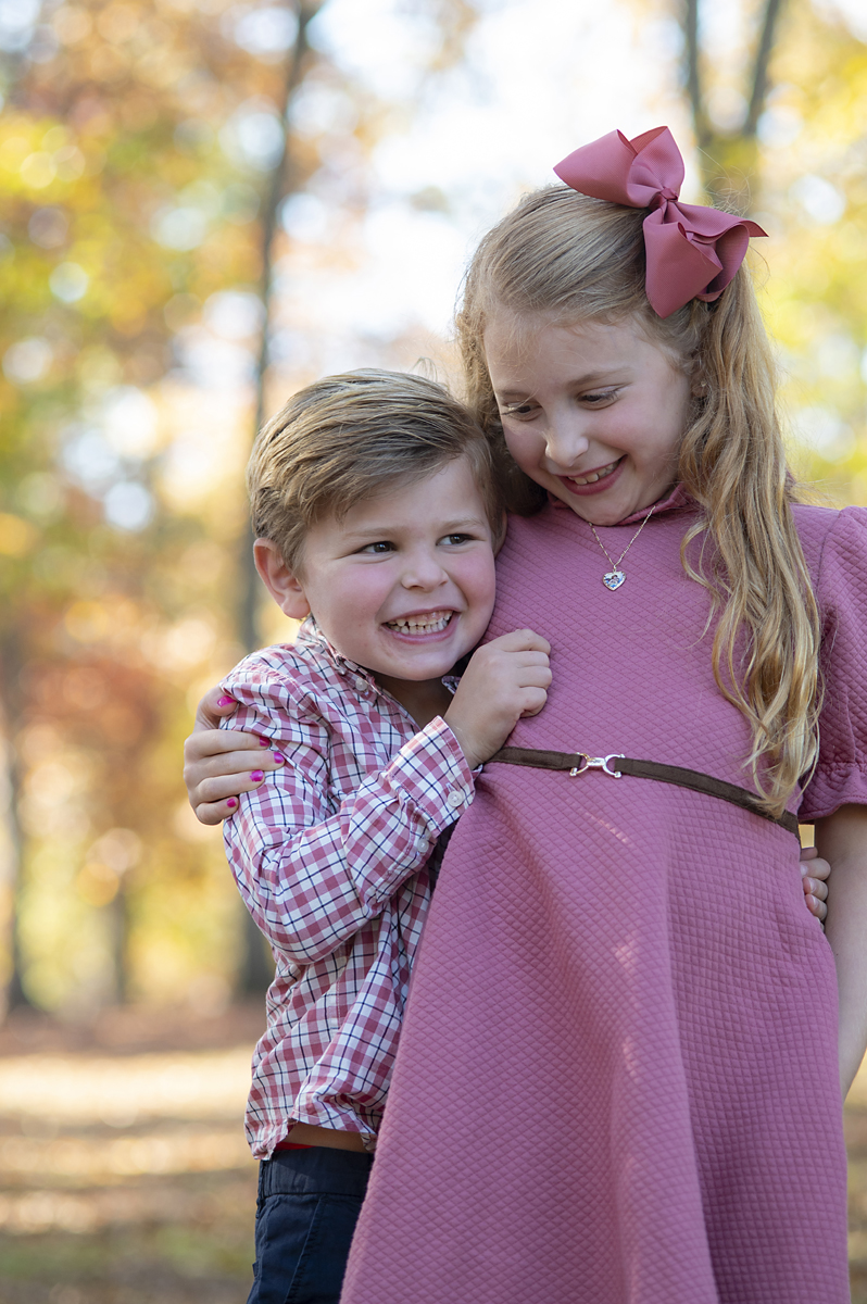 brother and sister during fall portraits
