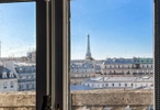 Eiffel Tower through Window at Musée d'Orsay Paris