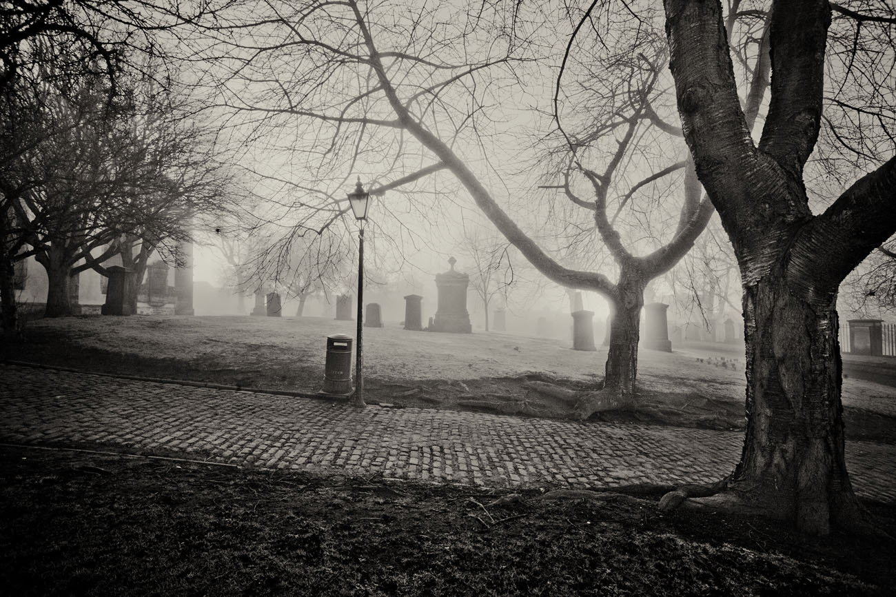gravestones in Greyfriars Kirk at night.