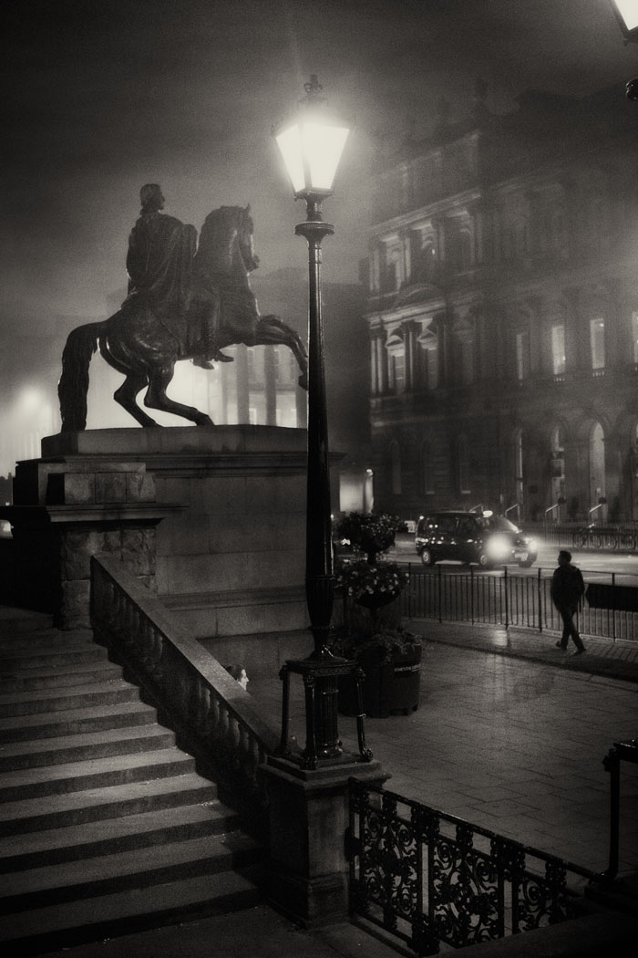 Duke of Wellington statue on Princes Steet at night in the fog