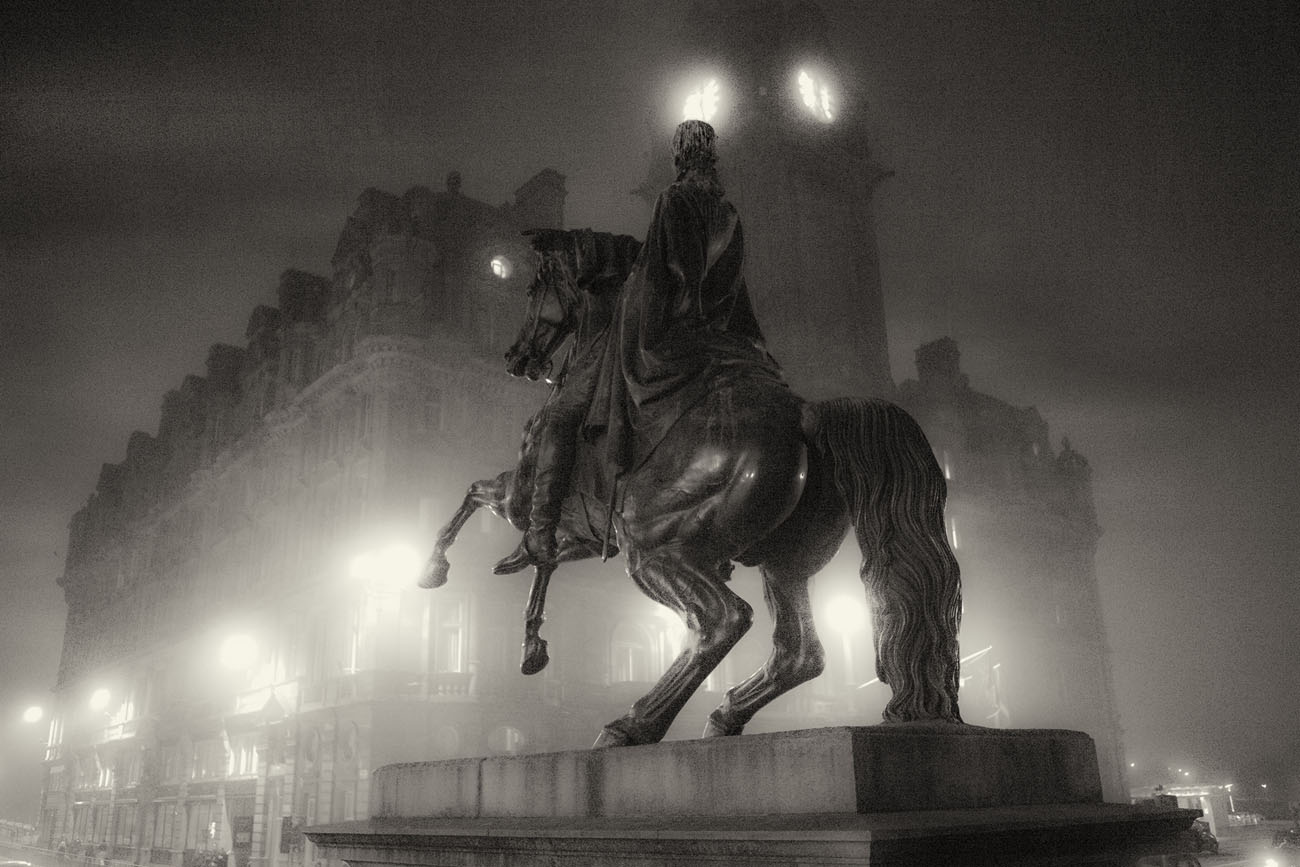 Duke of Wellington statue on Princes Steet at night in the fog