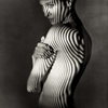 fine art black and white studio female nude with animal stripes projected