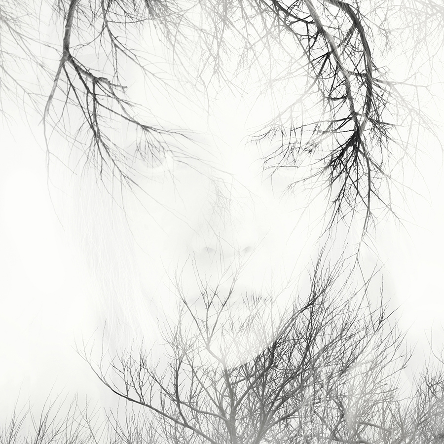 double exposure face in trees