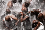 men gather for baptism and purification beneath the pounding waters of the sacred falls at Saut-d'Eau.  These waters also contain the powers of the ancient vodou spirit, Danbhallah.  This force is regenerative for the vodou pilgrim.