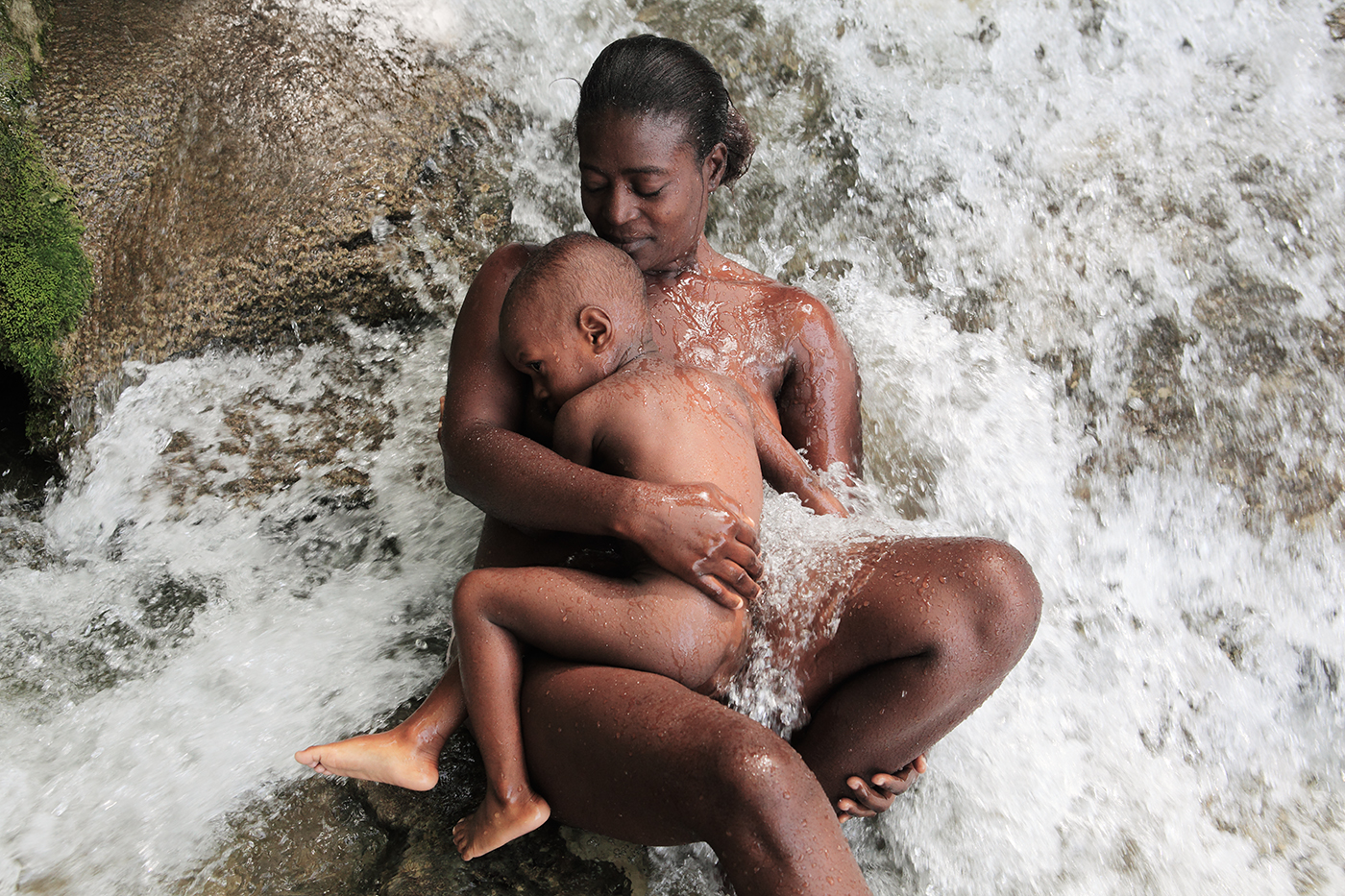 A mother and child at the pilgrimage of Saut-d'Eau.