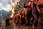 The ancient fire ceremony of Newroz marking the rite of Spring and the Kurdish New Year in the mountain city of Akre in northern Iraq.  A procession of torchbearers is led to the highest peak overlooking the city.  Fireworks and gunfire echo about in a celebration that has had special meaning since the fall of Saddam Hussein.  Previous to the American occupation in 2003, these people lived under the threat  of indiscriminate slaughter and genocide.  Now for the first time in centuries, they hold the beginnings of their own nation and the possibility of self-determination.  While still considered a province of Iraq, Kurdistan is the proud homeland of a people that have lived dangerously as outsiders for most of their history.