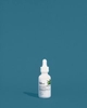 InstaNatural's All-In-One Hydrating Night Serum photographed on Blue.