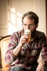 Man drinks Genesee beer out of a glass. Beverage photography for Genesee Brewery.