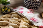 home made perogies are covered by a poppy flower patterned napkin for the Lady Linens catalog.