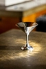 Light is being reflected from the hammered pewter martini goblet photographed for the Danforth Pewter catalog.