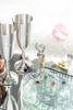 A collection of Danforth Pewter champagne flutes and accessories for their catalog.