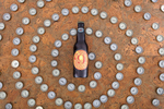 Magic Hat Brewing beer Number Nine with bottle caps in a swirl shape.