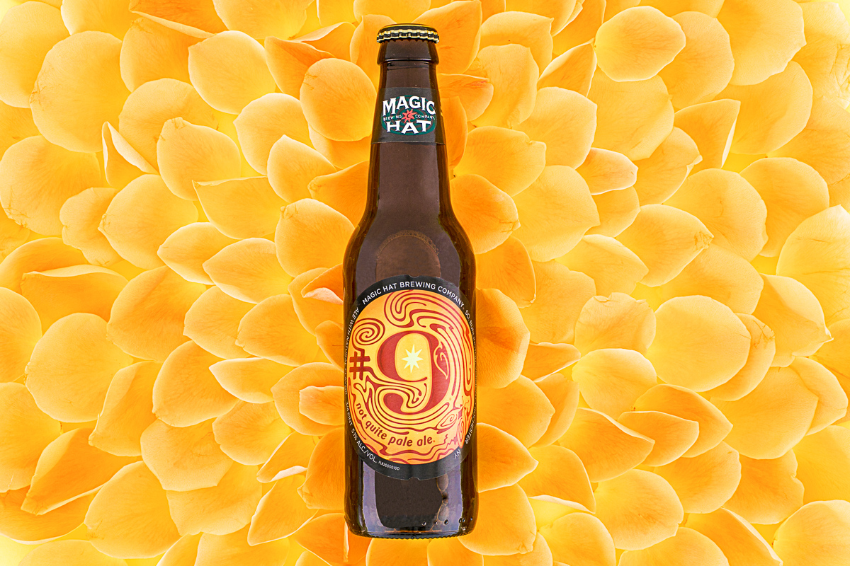 Magic Hat's #9 floating on a bed orange rose petals. By Jam Creative.