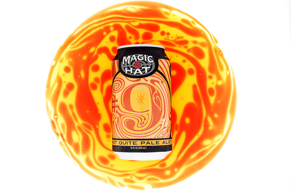 Magic Hat Brewing Company beer Number 9 Not Quite Pale Ale with yellow and orange swirls on white background.